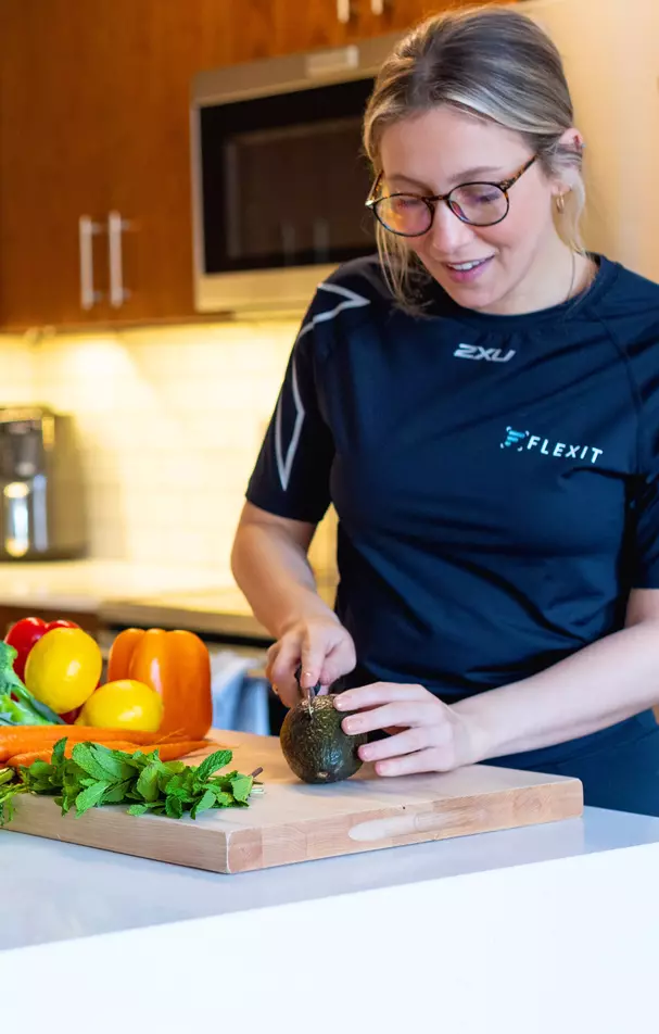 Health conscious woman preparing salad in a kitchen